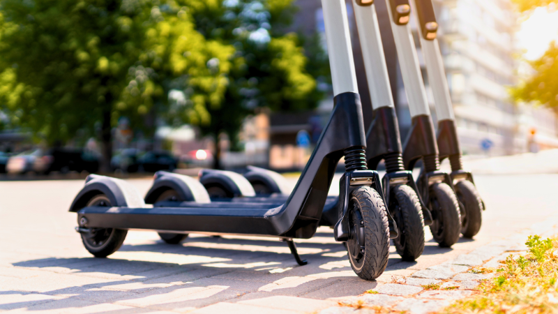 Row of electric scooters on a city street