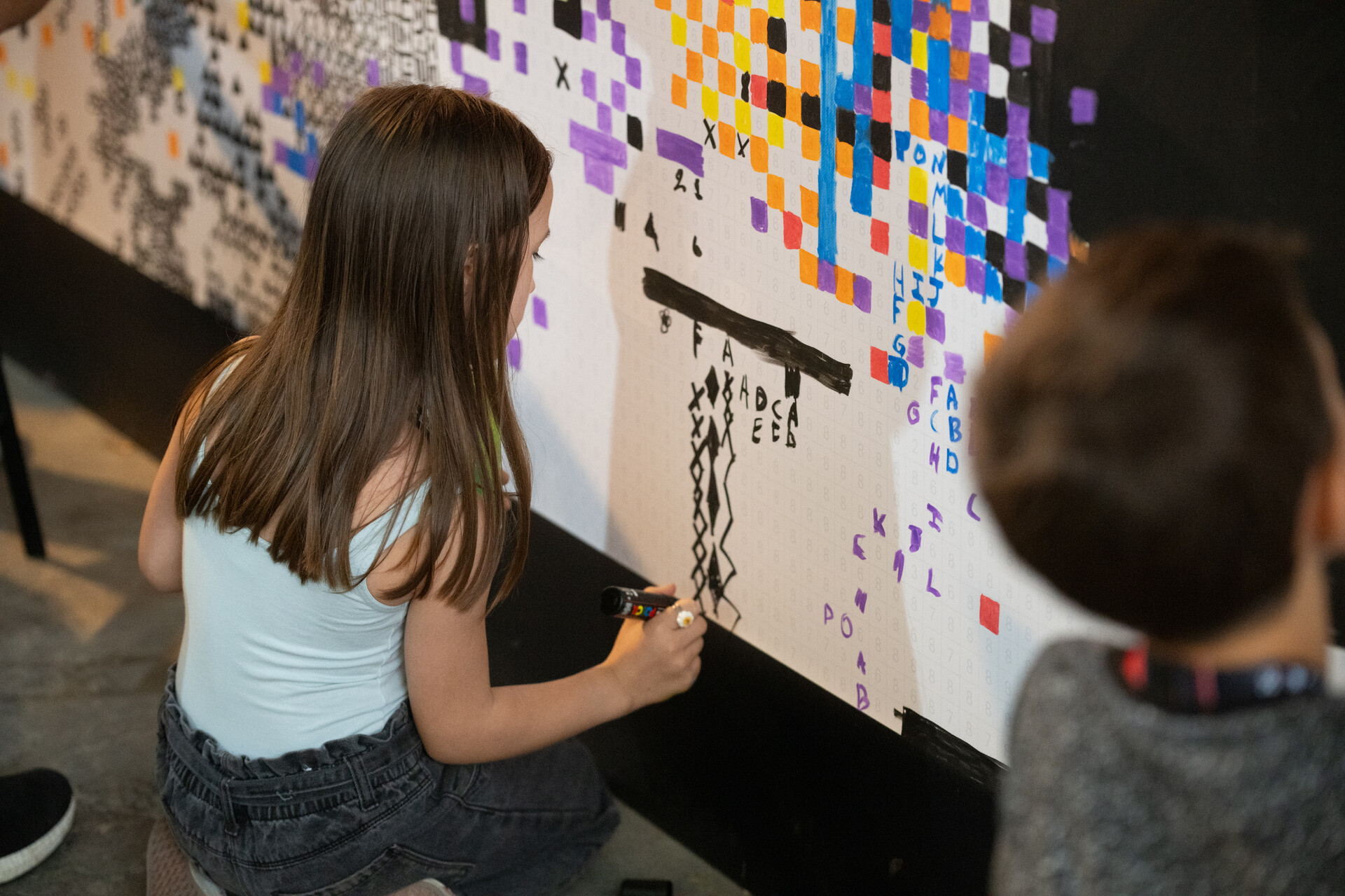 The grid filling in, numbers still visible in the unpainted cells